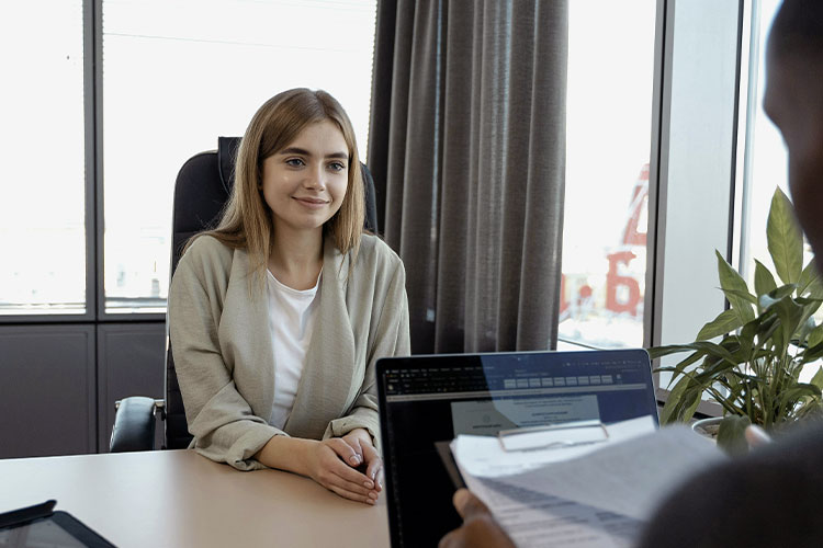 Woman on a job interview, represents our case study of a career change and how it can be the inner map to success.