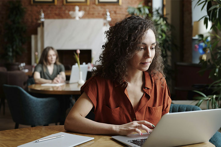 Woman focused at work, represents how women carry the silent burden of high functioning anxiety.