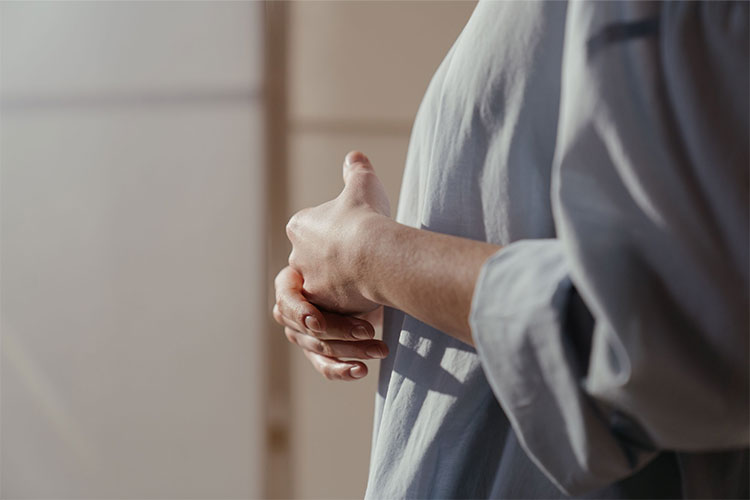 Close-up of a woman hands showing contemplation, represents how trauma work can help you find safety and healing.
